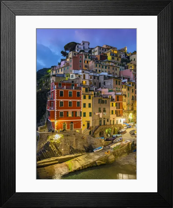 Framed Print : Dusk view of the colorful sea village of Riomaggiore, Cinque Terre, Liguria, Italy Framed Print : Dusk view of the colorful sea village of Riomaggiore, Cinque Terre, Liguria, Italy