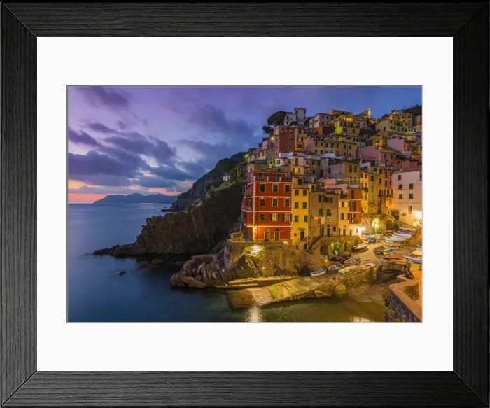 Framed Print : Dusk view of the colorful sea village of Riomaggiore, Cinque Terre, Liguria, Italy Framed Print : Dusk view of the colorful sea village of Riomaggiore, Cinque Terre, Liguria, Italy