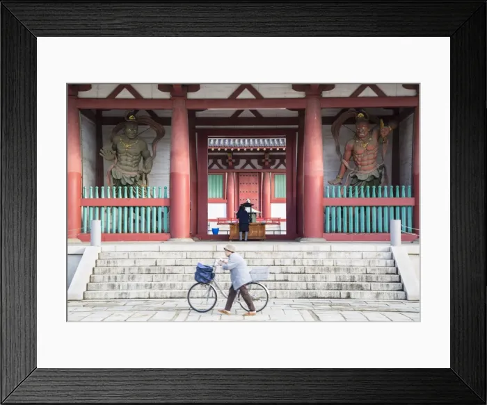 Framed Print : Woman pushing bicycle past Shitenno-ji temple, Tennoji, Osaka, Kansai, Japan Framed Print : Woman pushing bicycle past Shitenno-ji temple, Tennoji, Osaka, Kansai, Japan