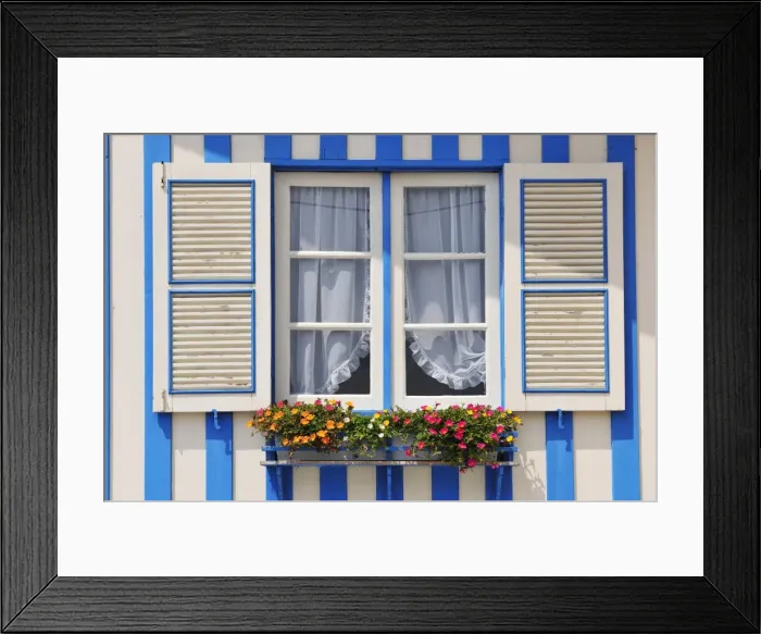 Framed Print : Window of a traditional striped painted house in the little seaside village of Costa Nova