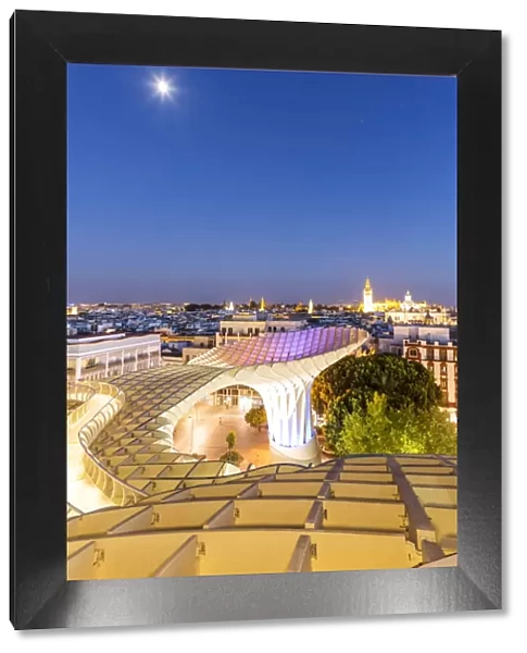 Spain, Andalusia, Seville. Metropol Parasol structure and city at dusk