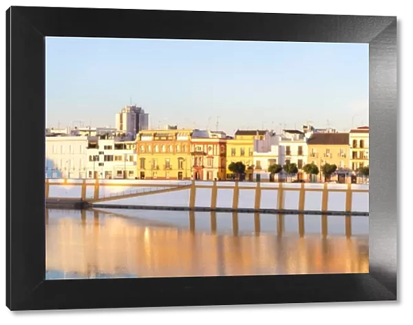 Spain, Andalusia, Seville. Triana district at sunrise with Guadalquivir river