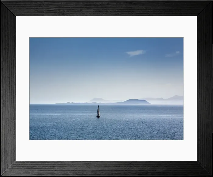 Framed Print : Sailing boat and Fuerteventura, from Playa Blanca, Lanzarote, Canary Islands, Spain Framed Print : Sailing boat and Fuerteventura, from Playa Blanca, Lanzarote, Canary Islands, Spain