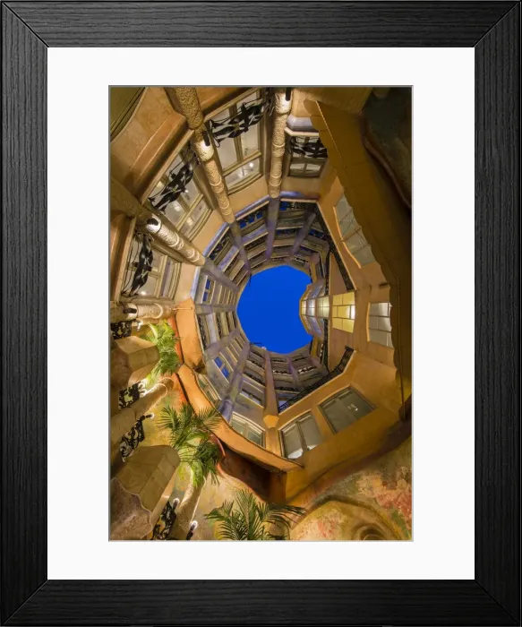 Framed Print : Bottom view of the inner courtyard of Casa Mila or La Pedrera at dusk, Barcelona Framed Print : Bottom view of the inner courtyard of Casa Mila or La Pedrera at dusk, Barcelona