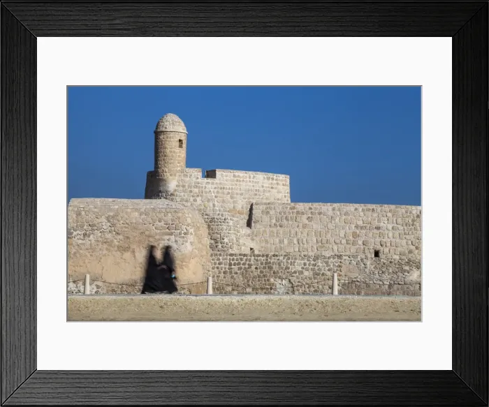 Framed Print : Bahrain, Manama, Women walking past Bahrain Fort - Qal at al-Bahrain Framed Print : Bahrain, Manama, Women walking past Bahrain Fort - Qal at al-Bahrain