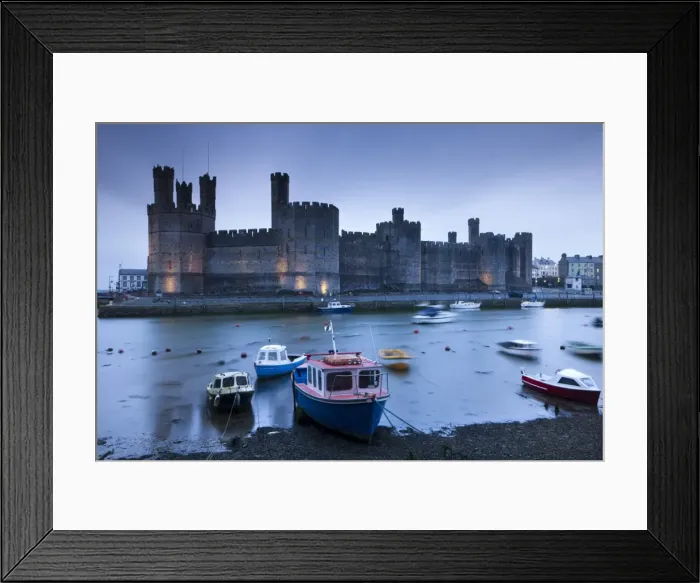 Framed Print : Foreboding evening skies above the immense Caernarfon Castle, Caernarfon, Gwynedd, North Wales Framed Print : Foreboding evening skies above the immense Caernarfon Castle, Caernarfon, Gwynedd, North Wales