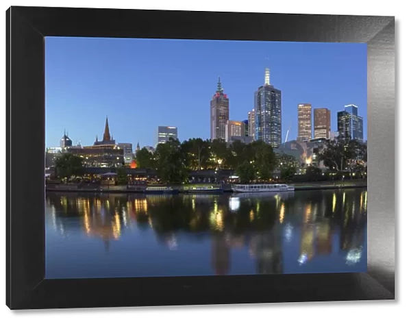 Melbourne skyline along Yarra River at dusk, Melbourne, Victoria, Australia