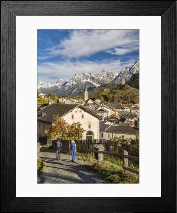 Framed Print : Hikers admire Ardez village surrounded by woods and snowy peaks Lower Engadine Canton Framed Print : Hikers admire Ardez village surrounded by woods and snowy peaks Lower Engadine Canton