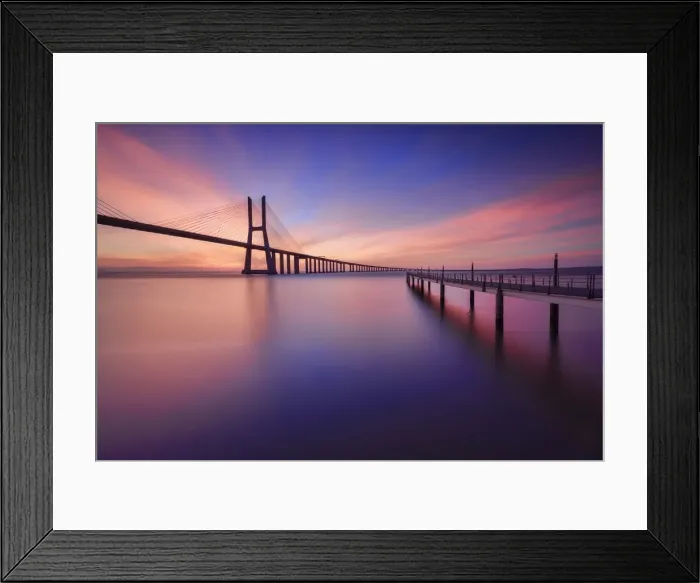 Framed Print : The colors of dawn on Vasco da Gama Bridge that spans the Tagus River in Parque das NaA'A§A'Aµes Lisbon Portugal Europe