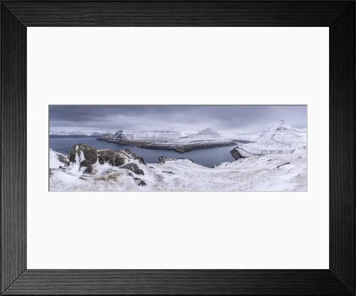 Framed Print : Snow covered mountain scenery above Funningsfjordur on the island of Eysturoy, Faroe Islands Framed Print : Snow covered mountain scenery above Funningsfjordur on the island of Eysturoy, Faroe Islands