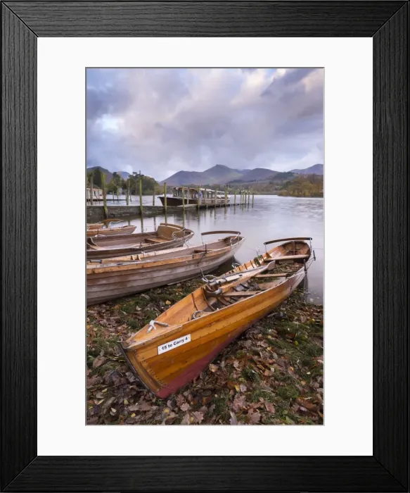 Framed Print : Wooden rowing boats beside Derwent Water in the Lake District, Cumbria, England. Autumn Framed Print : Wooden rowing boats beside Derwent Water in the Lake District, Cumbria, England. Autumn