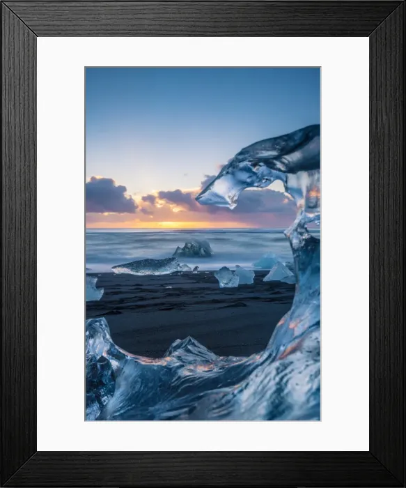 Framed Print : Jokulsarlon, Iceland. The black Breidamerkursandur beach seen through a melted block Framed Print : Jokulsarlon, Iceland. The black Breidamerkursandur beach seen through a melted block