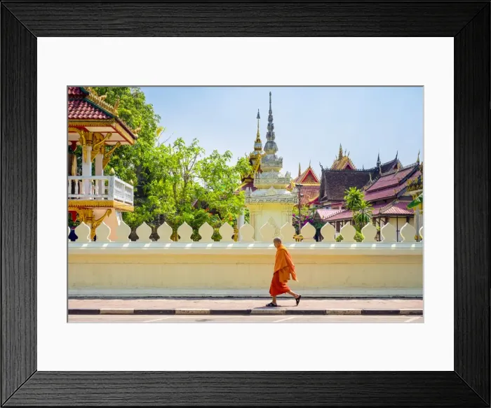 Framed Print : A buddhist monk walks past Wat Si Saket (Wat Sisaket) temple in central Vientiane, Laos Framed Print : A buddhist monk walks past Wat Si Saket (Wat Sisaket) temple in central Vientiane, Laos
