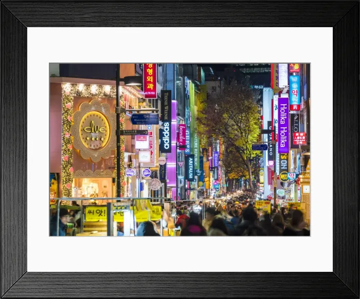Framed Print : Myeong-Dong district at night. The location is the premiere district for shopping Framed Print : Myeong-Dong district at night. The location is the premiere district for shopping