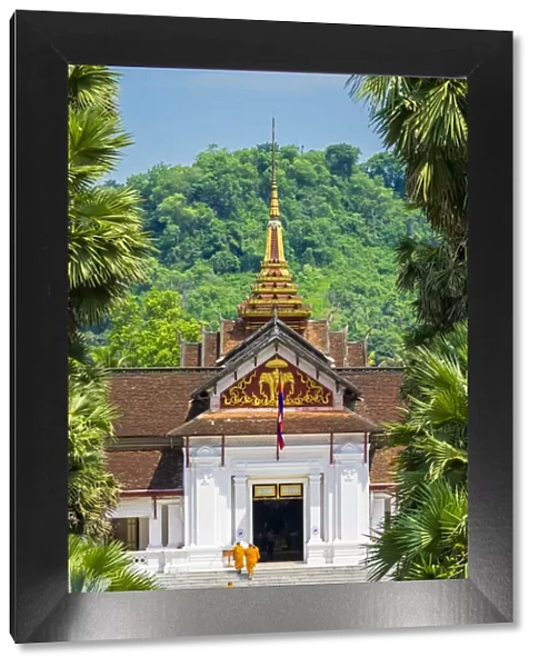 Monks entering Royal Palace Museum in Luang Prabang, Louangphabang Province, Laos