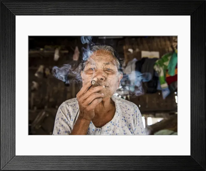 Framed Print : Rakhine state, Myanmar. Chin woman with traditional tattooed face smoking Framed Print : Rakhine state, Myanmar. Chin woman with traditional tattooed face smoking