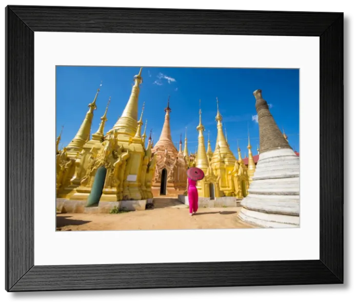 Framed Print : Indein, Inlay Lake, Shan State, Myanmar. Woman with red dress and umbrella watching Framed Print : Indein, Inlay Lake, Shan State, Myanmar. Woman with red dress and umbrella watching