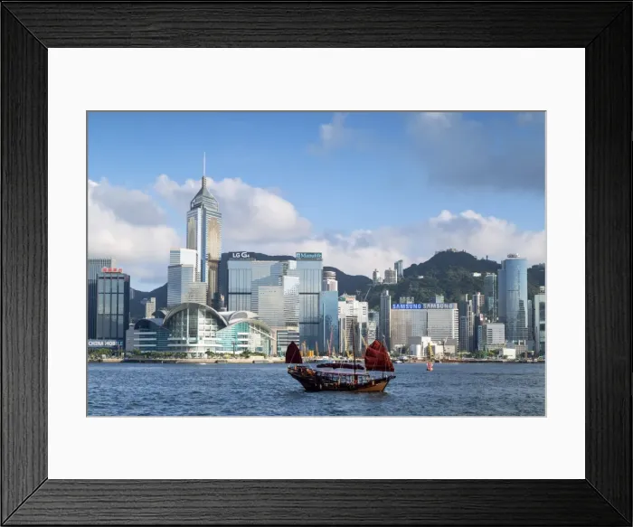Framed Print : Junk boat passing Convention Centre and Hong Kong Island skyline, Hong Kong, China