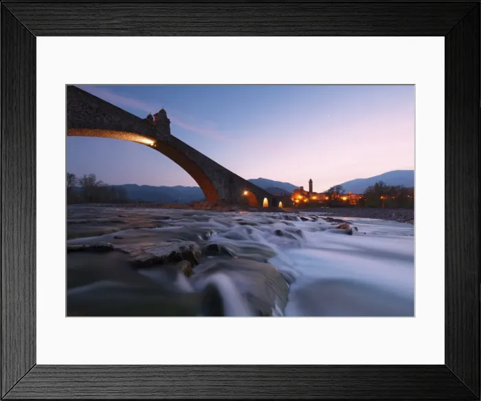 Framed Print : The bridge Gobbo of Bobbio at dusk, Piacenza district, Italy Framed Print : The bridge Gobbo of Bobbio at dusk, Piacenza district, Italy