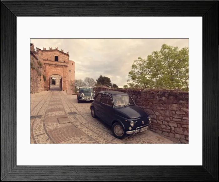 Framed Print : Glimpse of Spello with vintage cars in the foreground, Spello, Perugia district, Umbria