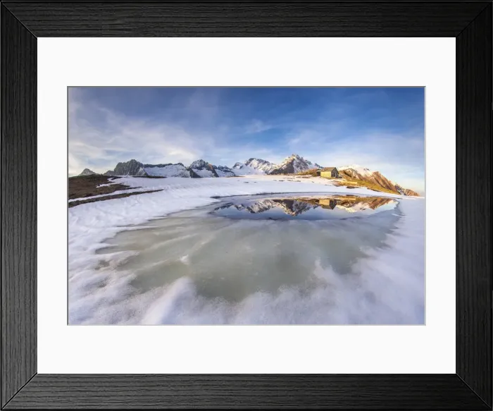 Framed Print : Mount Disgrazia and Corni Bruciati reflecting in the Lake Meltri in the thawing season Framed Print : Mount Disgrazia and Corni Bruciati reflecting in the Lake Meltri in the thawing season