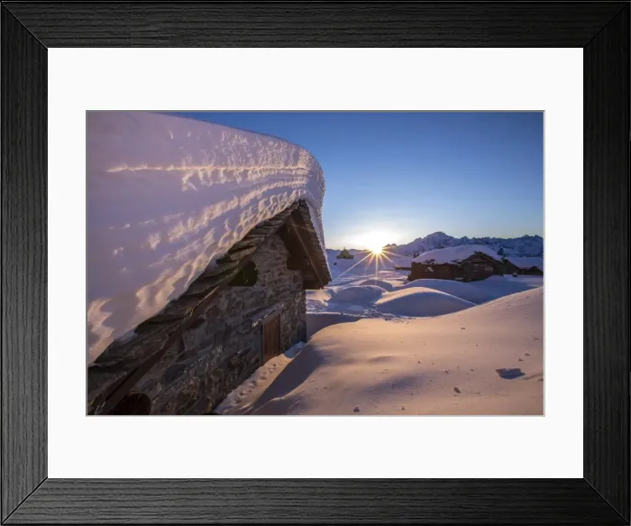 Framed Print : The last rays of sun light up the Prabello alp chalets covered with snow