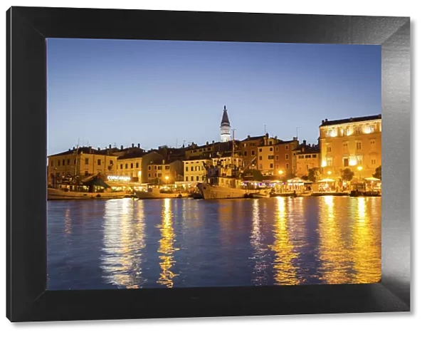 Rovinj, Croatia, Europe. View of the city at dusk from the harbour