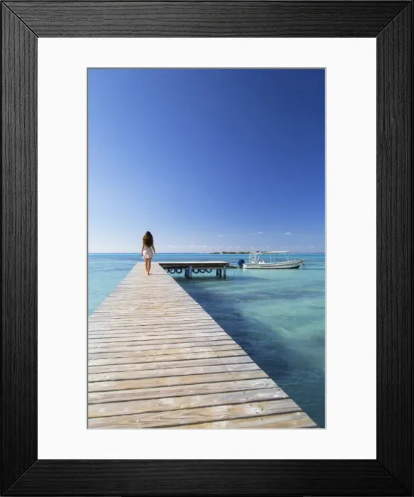 Framed Print : Woman walking on jetty, Hauru Point, Mo orea, Society Islands, French Polynesia (MR)