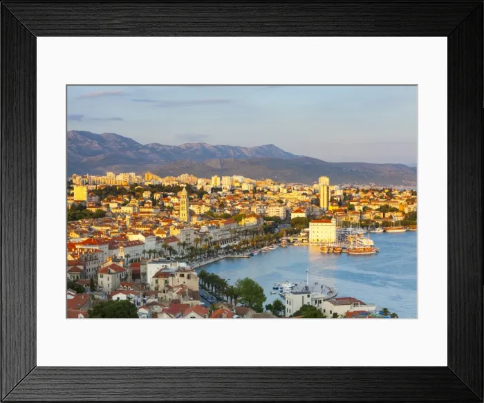 Framed Print : Elevevated view over the picturesque harbour city of Split illuminated at sunset Framed Print : Elevevated view over the picturesque harbour city of Split illuminated at sunset