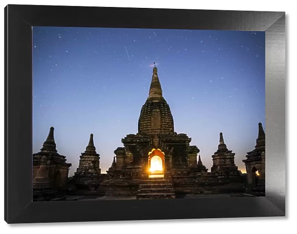 Myanmar, Mandalay division, Bagan. Buddhist pagoda at night under starry sky