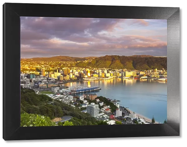 Elevated view over central Wellington illuminated at sunrise, Wellington, North Island