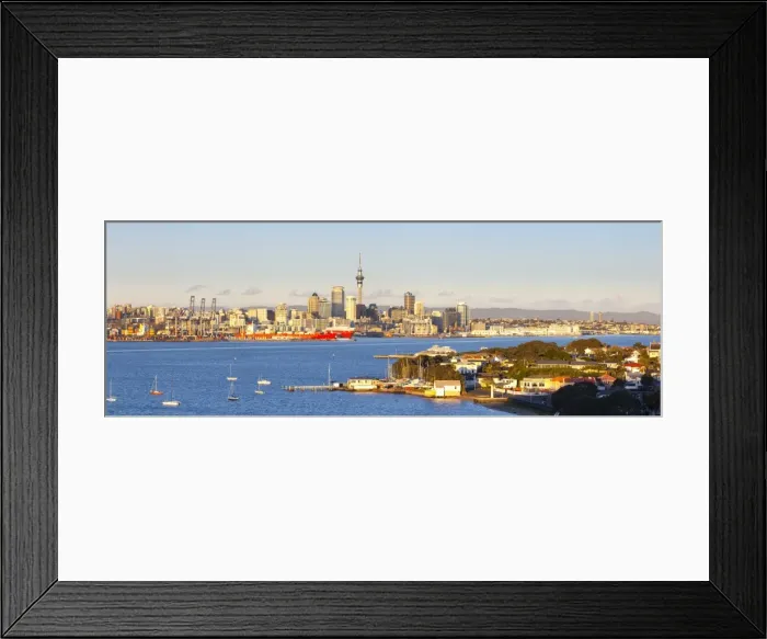 Framed Print : Elevated View Over Devenport towards Central Business District illuminated at sunrise, Auckland, New Zealand Framed Print : Elevated View Over Devenport towards Central Business District illuminated at sunrise, Auckland, New Zealand