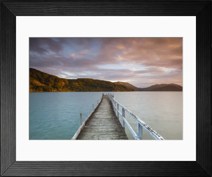 Framed Print : Sunset over picturesque wharf in idyllic Kenepuru Sound, Marlborough Sounds, South Island Framed Print : Sunset over picturesque wharf in idyllic Kenepuru Sound, Marlborough Sounds, South Island