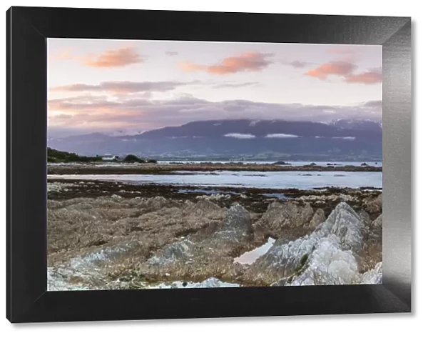 Rugged coastal landscape illuminated at sunset, Kaikoura, South Island, New Zealand