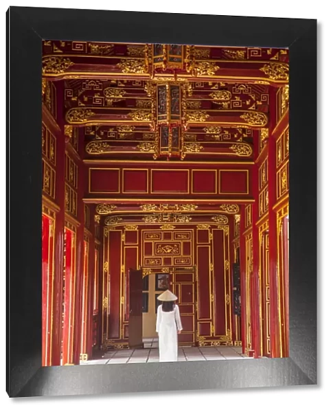 Woman wearing Ao Dai dress in Imperial Palace inside Citadel, Hue, Thua Thien-Hue