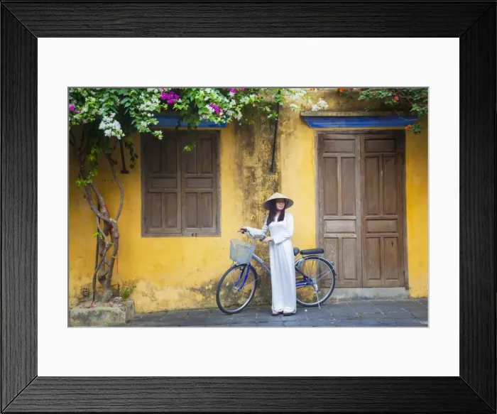 Framed Print : Woman wearing Ao Dai dress with bicycle, Hoi An (UNESCO World Heritage Site), Quang Ham Framed Print : Woman wearing Ao Dai dress with bicycle, Hoi An (UNESCO World Heritage Site), Quang Ham