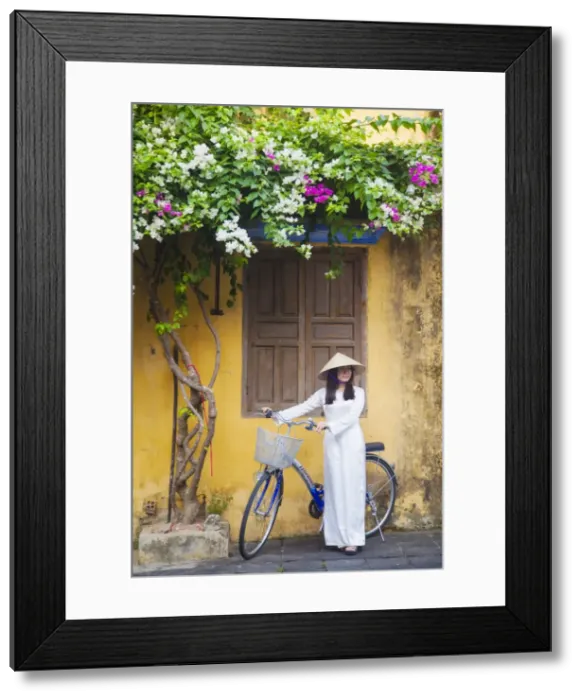 Framed Print : Woman wearing Ao Dai dress with bicycle, Hoi An (UNESCO World Heritage Site), Quang Ham Framed Print : Woman wearing Ao Dai dress with bicycle, Hoi An (UNESCO World Heritage Site), Quang Ham