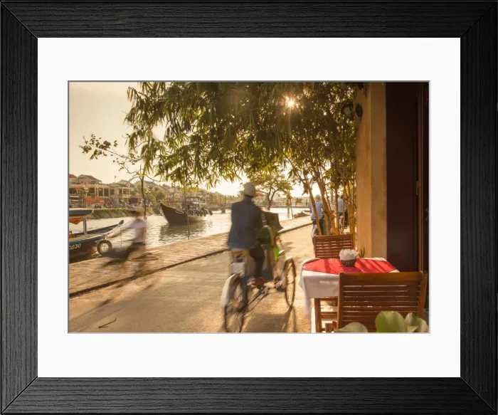 Framed Print : Cyclos passing restaurant, Hoi An (UNESCO World Heritage Site), Quang Ham, Vietnam