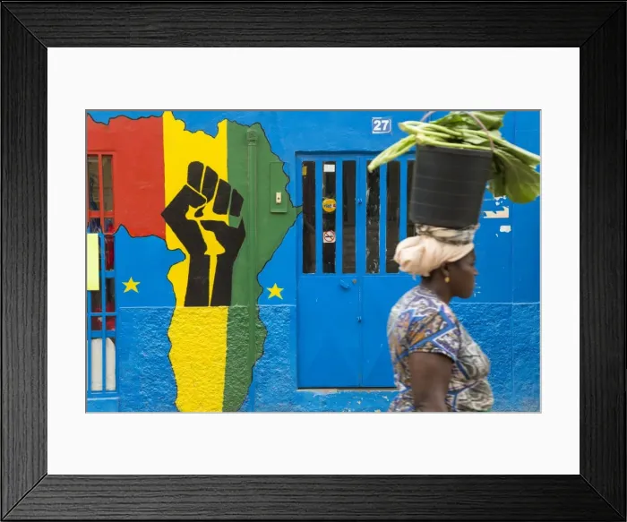 Framed Print : Woman with a bucket of vegetables in front of Africa shop front, Praia, Santiago, Cape Verde Framed Print : Woman with a bucket of vegetables in front of Africa shop front, Praia, Santiago, Cape Verde