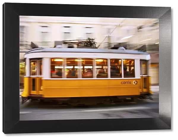 Europe, Portugal, Lisbon, a speeding tram (streetcar) in the city center