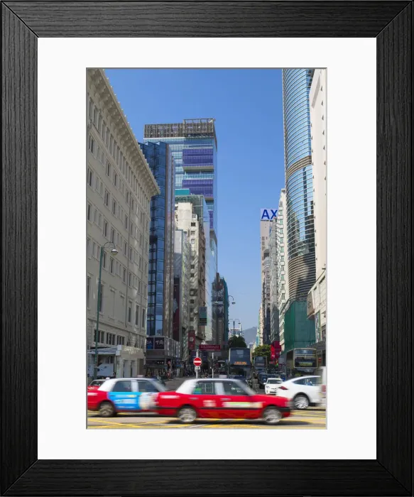 Framed Print : Taxis passing Nathan Road, Tsim Sha Tsui, Hong Kong Framed Print : Taxis passing Nathan Road, Tsim Sha Tsui, Hong Kong