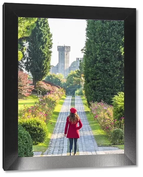 A tourist walks along a pathway in Sigurt√ park. Valeggio sul Mincio, Verona, Veneto, Italy (MR)