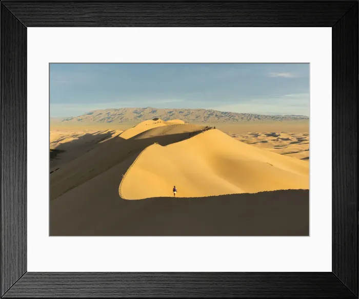 Framed Print : People walking on Khongor sand dunes in Gobi Gurvan Saikhan National Park. Sevrei district