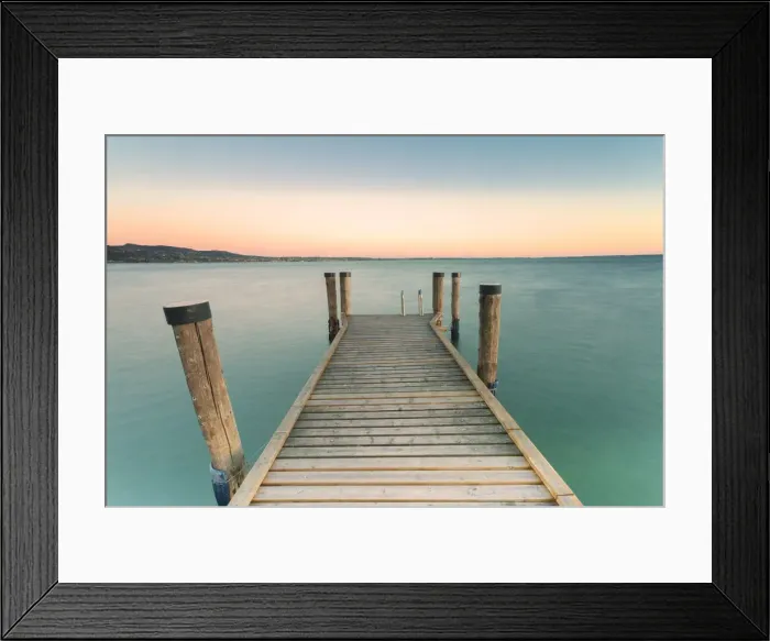 Framed Print : The wooden pier of Punta San Vigilio on the eastern shore of Lake Garda at sunset Framed Print : The wooden pier of Punta San Vigilio on the eastern shore of Lake Garda at sunset