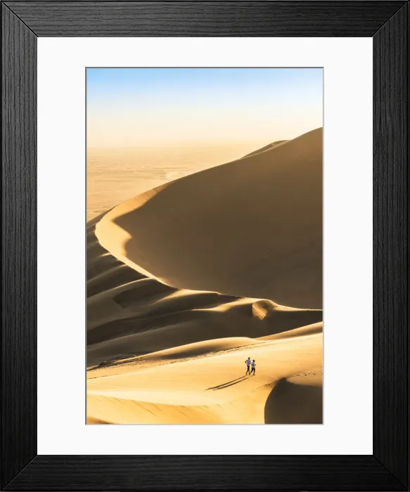 Framed Print : Walvis Bay, Namibia, Africa. Tourists walking on the sand dunes at sunset