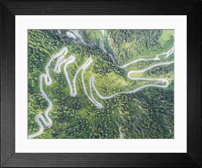 Framed Print : Aerial view of curves of the road between woods, Maloja Pass, Bregaglia Valley, canton