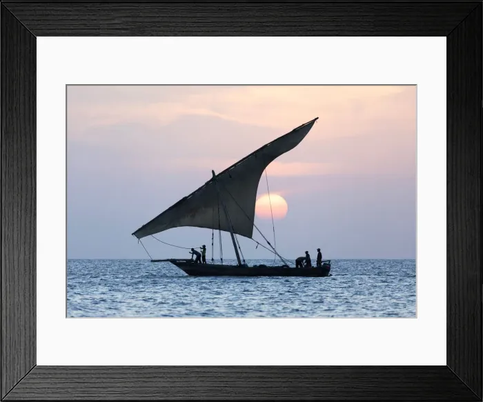 Framed Print : A dhow sails in front of the setting sun, Stone Tpwn, Zanzibar, Tanzania