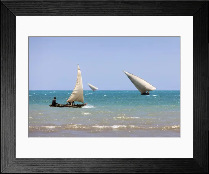 Framed Print : Three small dhows are out fishing near the coast, Zanzibar, Tanzania Framed Print : Three small dhows are out fishing near the coast, Zanzibar, Tanzania
