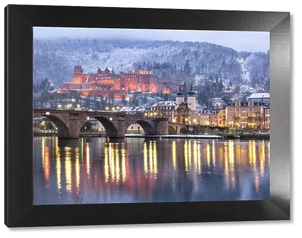 Heidelberg castle in winter with the Old Bridge and Church of the Holy Spirit along