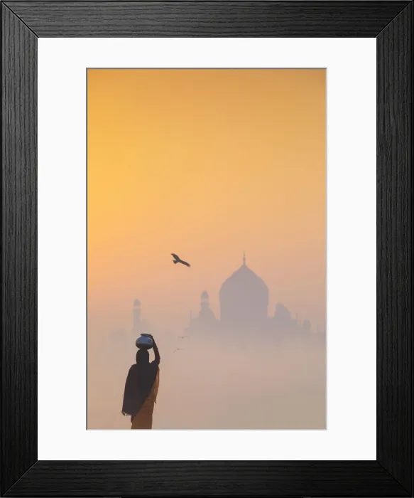 Framed Print : India, water carrying a water pot on a foggy morning with the sun rising on the Taj Mahal Framed Print : India, water carrying a water pot on a foggy morning with the sun rising on the Taj Mahal